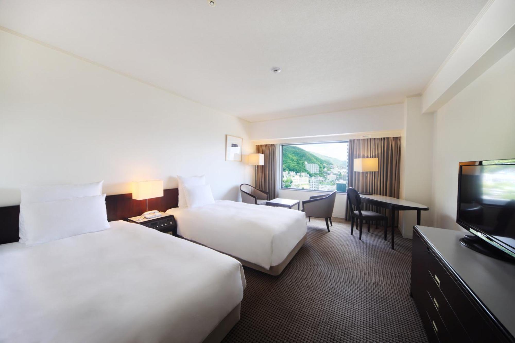 Hotel Ana Crowne Plaza Kobe By Ihg Esterno foto A room at the hotel
